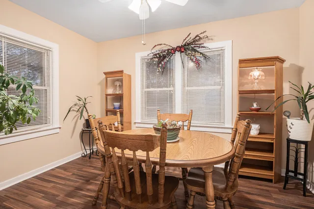 a dining room with furniture and window