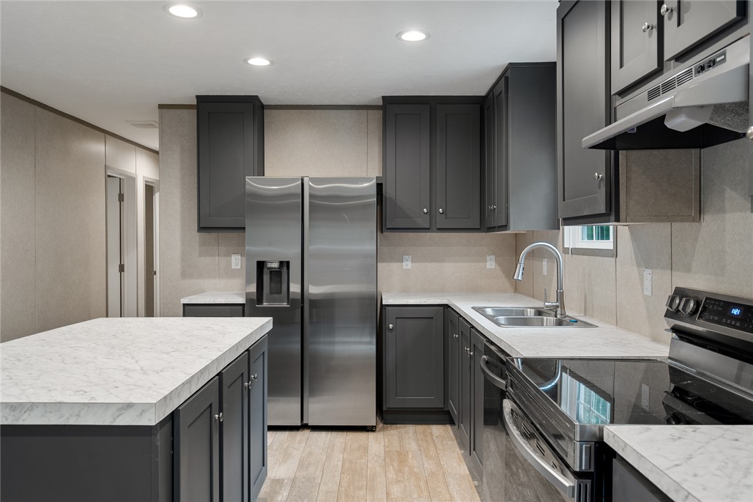 419 Austin Drive Anderson, SC 29624 - Photo 18 of 36 This modern kitchen features sleek countertops, stainless steel appliances, and ample cabinetry for all your culinary needs.
