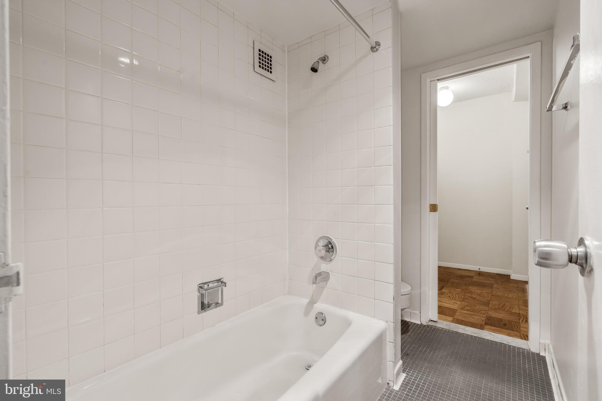 4515 Willard Avenue, Unit 1120S Chevy Chase, MD 20815 - Photo 12 of 50 a bathroom with a bathtub and shower