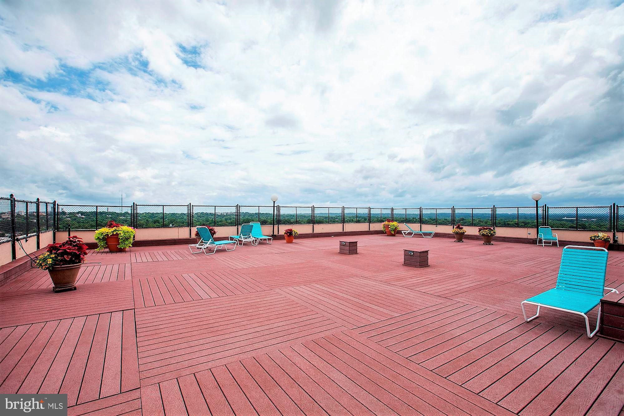 4515 Willard Avenue, Unit 1120S Chevy Chase, MD 20815 - Photo 31 of 50 a view of a terrace with wooden floor and city view
