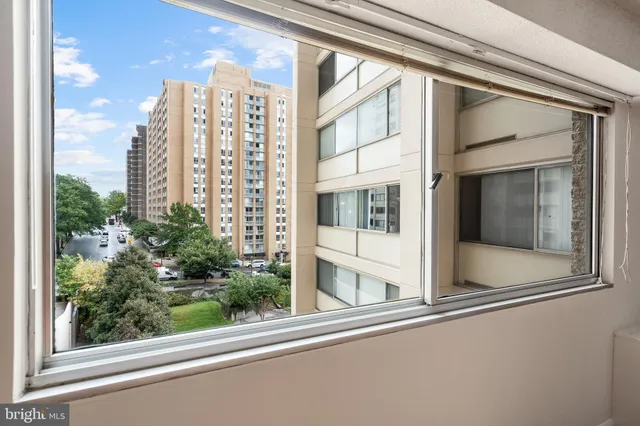 a view of a balcony with a tree