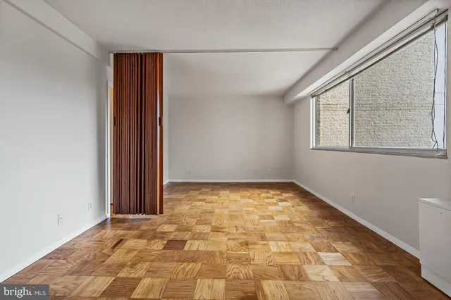 a view of an empty room with a window