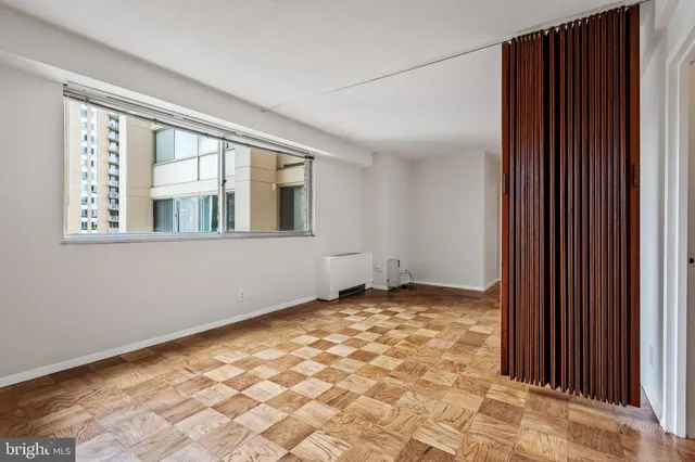 a view of an empty room with windows