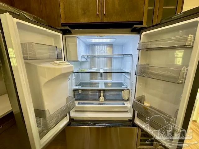 a stove top oven sitting inside of a kitchen