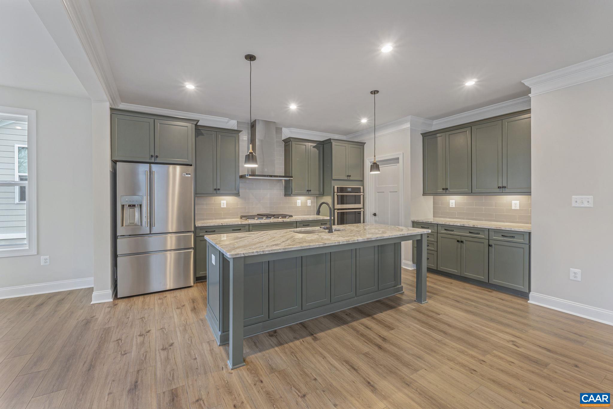 62 A Springdale Road Waynesboro, VA 22980 - Photo 11 of 37 a kitchen with stainless steel appliances granite countertop a refrigerator a sink dishwasher a stove and a refrigerator with wooden floor