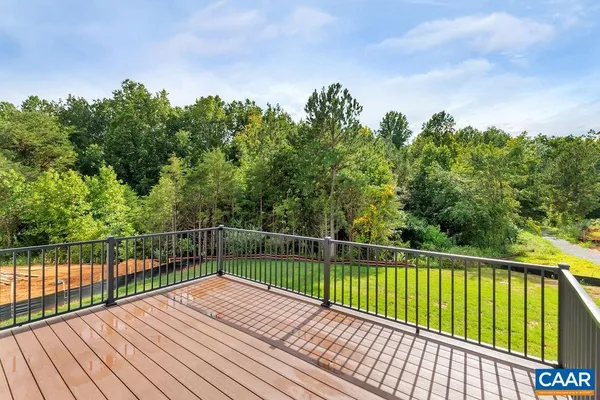 a view of balcony with wooden floor