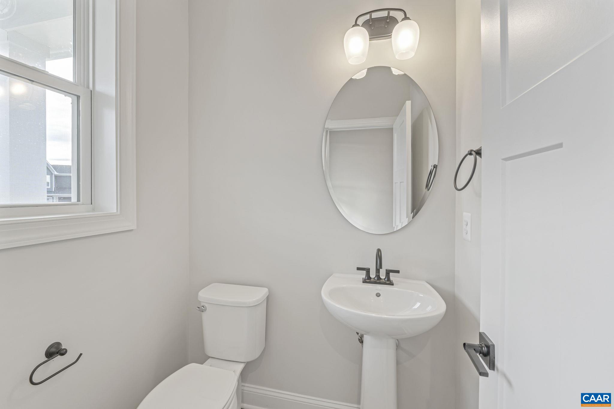 62 A Springdale Road Waynesboro, VA 22980 - Photo 6 of 37 a bathroom with a toilet a sink and mirror
