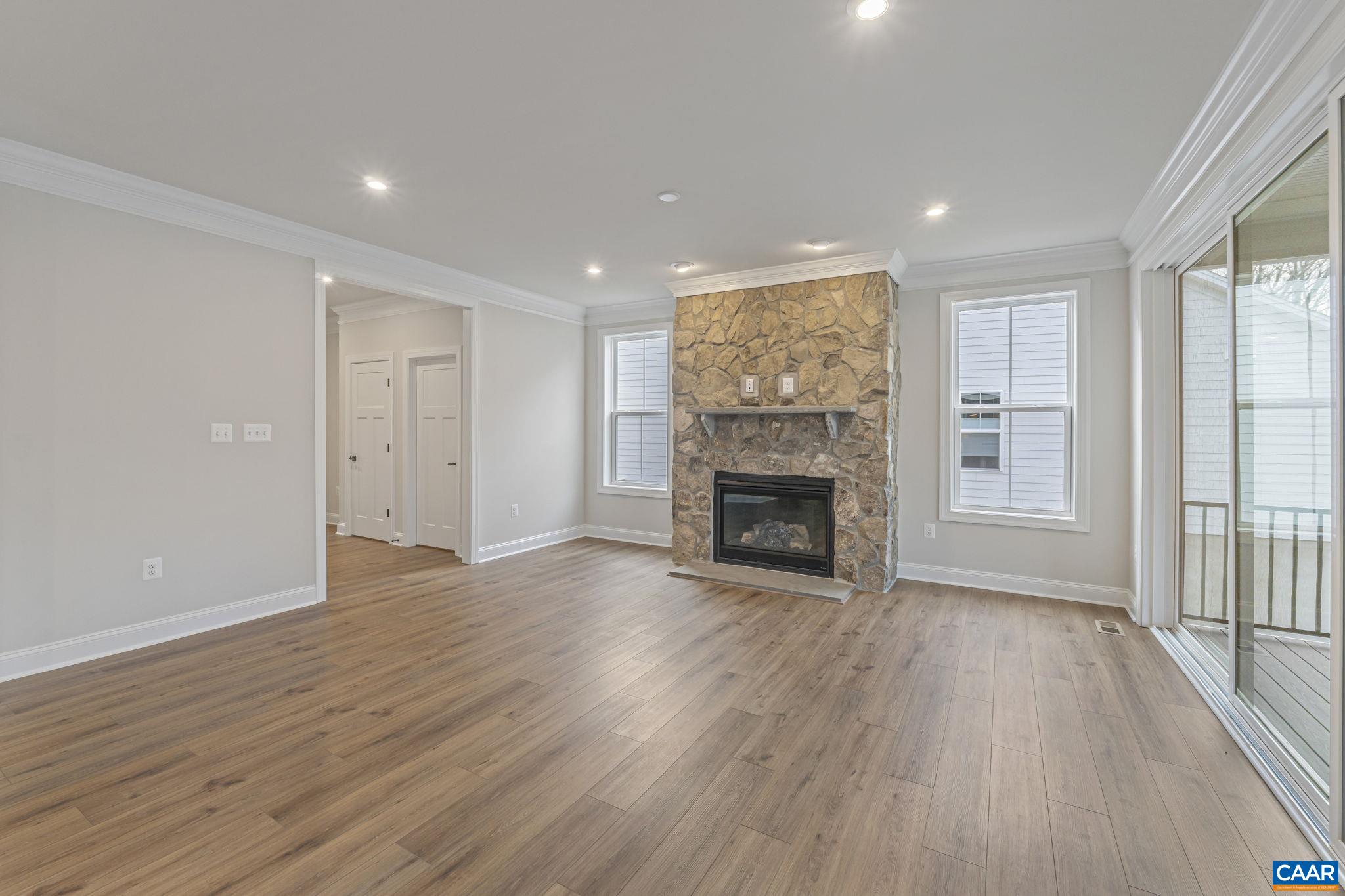 62 A Springdale Road Waynesboro, VA 22980 - Photo 9 of 37 a view of a livingroom with wooden floor and a fireplace