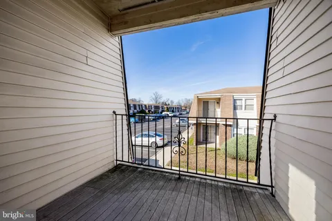 a view of a balcony with wooden floor