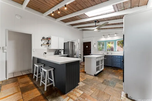 a utility room with a stove a washer and dryer