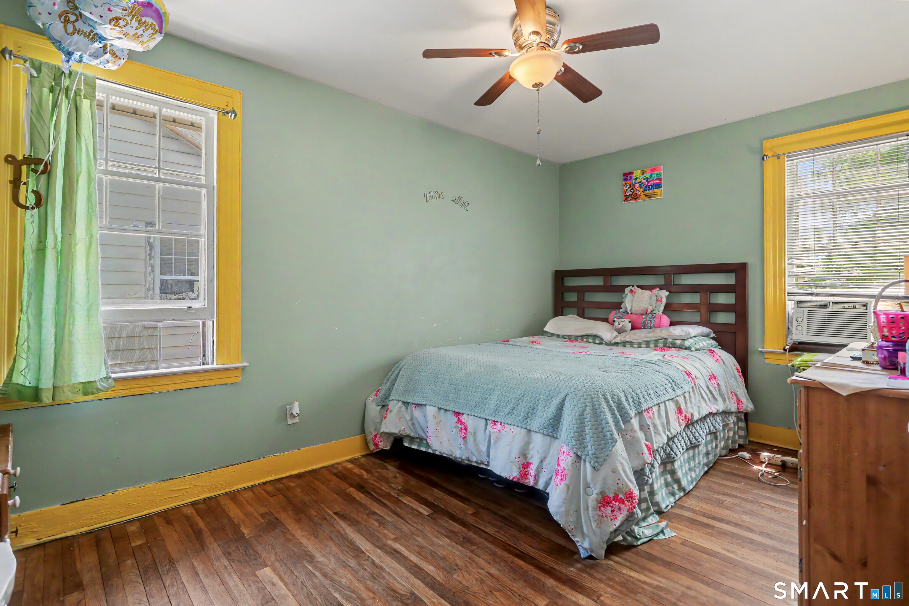 94 2nd Street Hamden, CT 06514 - Photo 23 of 31 a bedroom with a bed and wooden floor