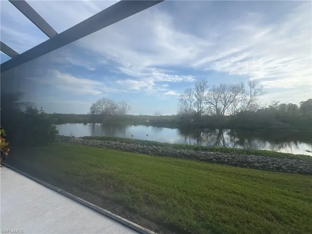 a bedroom with a bed and a ceiling fan