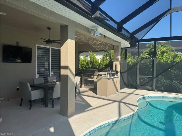 a kitchen with stainless steel appliances a refrigerator and cabinets