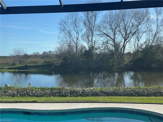 a kitchen with stainless steel appliances kitchen island granite countertop a sink and cabinets