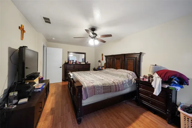 a bed room with a bed and a television