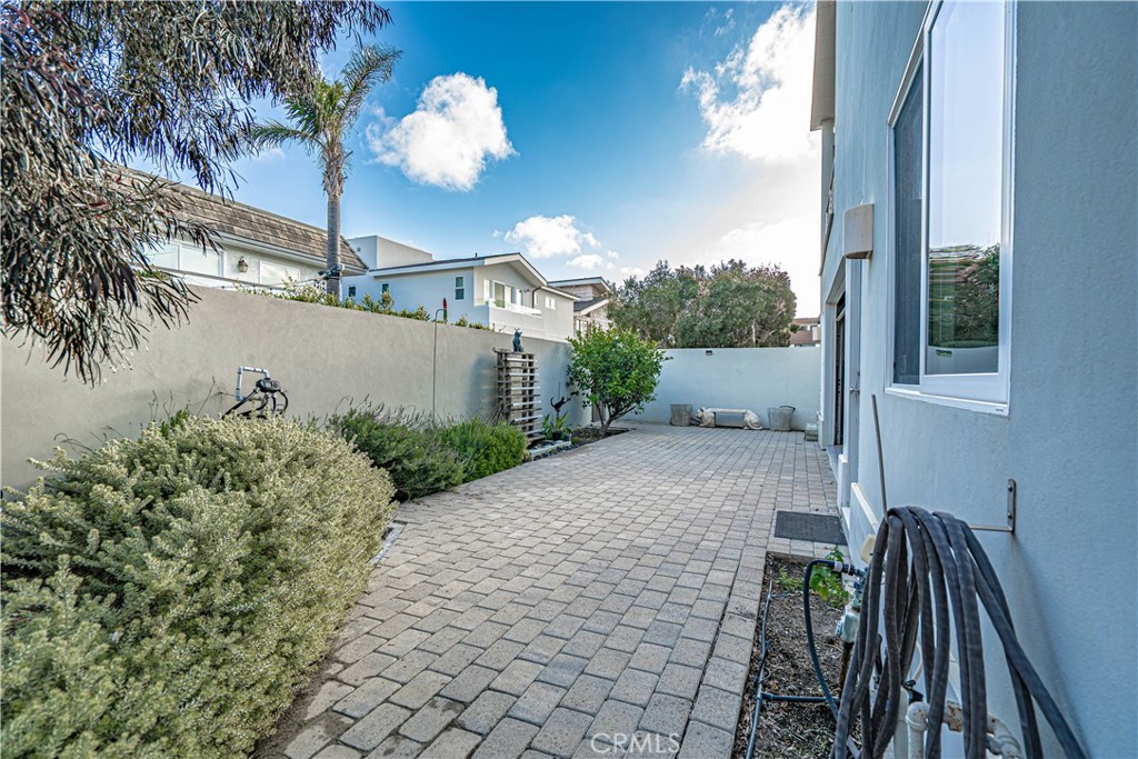 5220 Terramar Way Oxnard, CA 93035 - Photo 18 of 75 a view of a house with a yard and potted plants