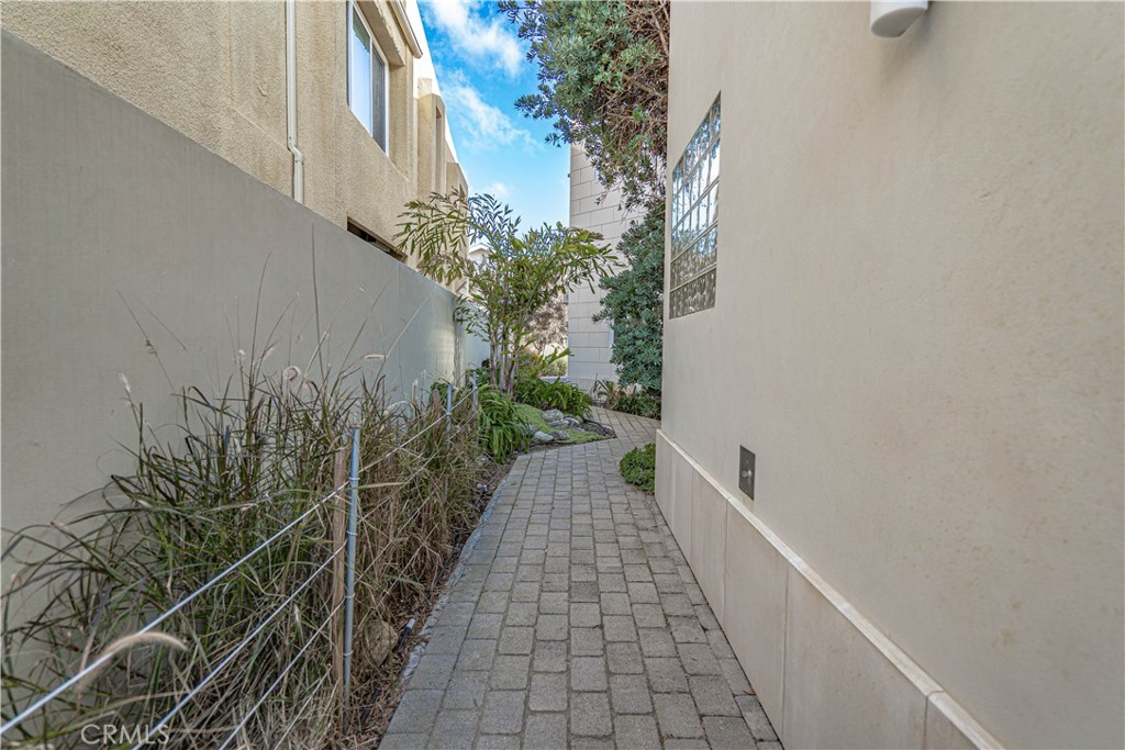 5220 Terramar Way Oxnard, CA 93035 - Photo 3 of 75 a view of a pathway both side of house