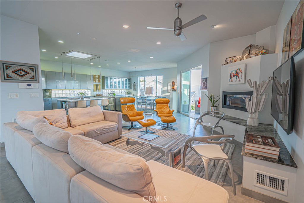 5220 Terramar Way Oxnard, CA 93035 - Photo 41 of 75 a living room with furniture a flat screen tv and a fireplace