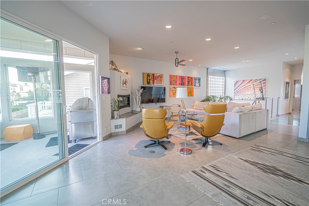 5220 Terramar Way Oxnard, CA 93035 - Photo 42 of 75 a living room with furniture a flat screen tv and a table