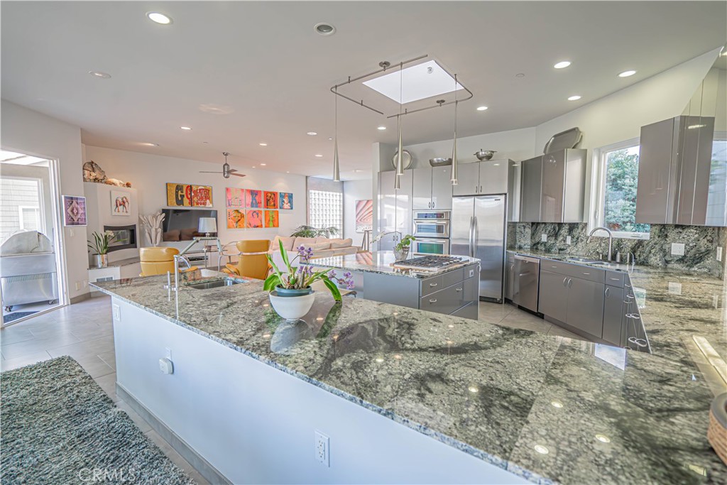 5220 Terramar Way Oxnard, CA 93035 - Photo 47 of 75 a large kitchen with kitchen island a large counter top stainless steel appliances and cabinets