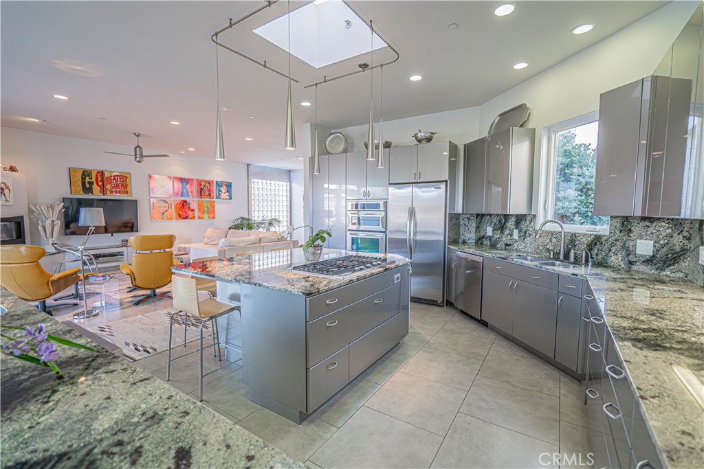 5220 Terramar Way Oxnard, CA 93035 - Photo 48 of 75 a large kitchen with a large counter top appliances and cabinets