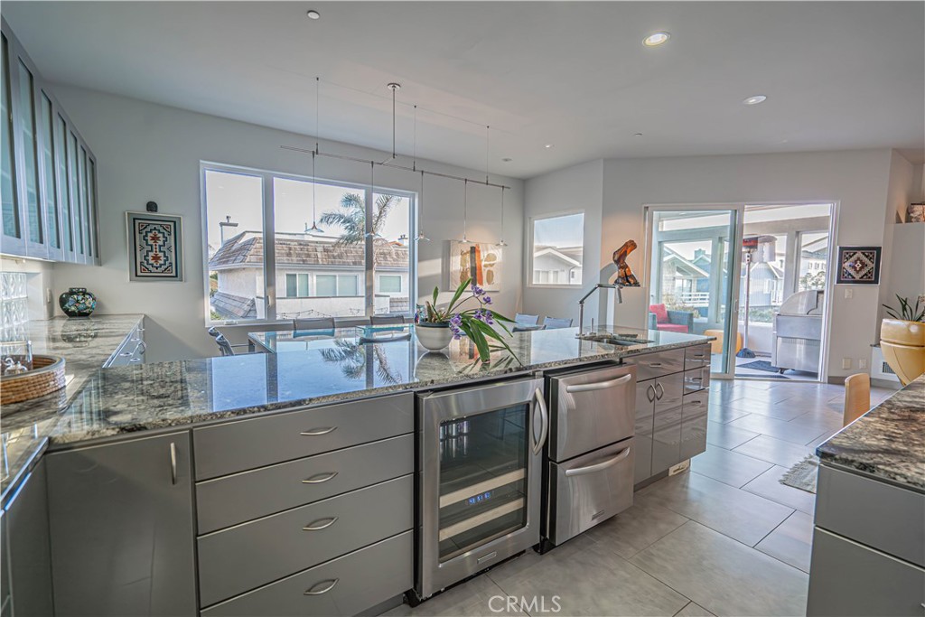 5220 Terramar Way Oxnard, CA 93035 - Photo 50 of 75 a kitchen with stainless steel appliances granite countertop a stove and more cabinets