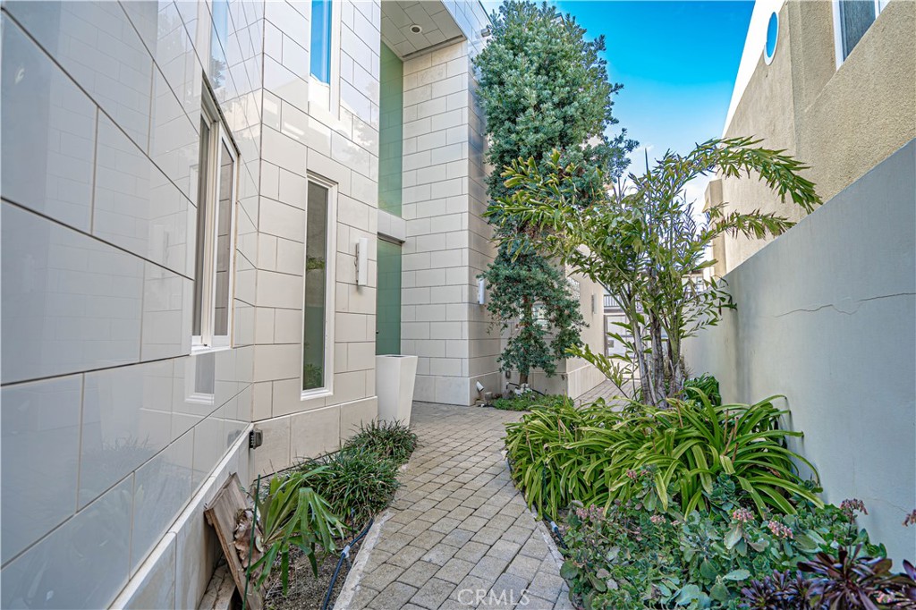 5220 Terramar Way Oxnard, CA 93035 - Photo 5 of 75 a couple of flower plants in front of door