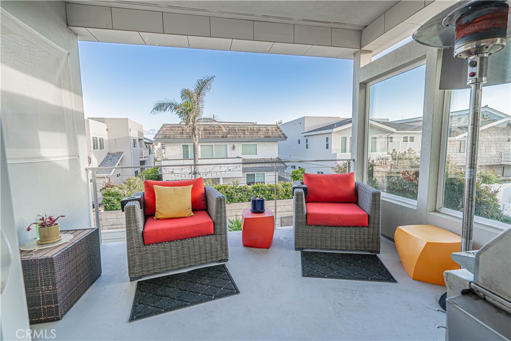 5220 Terramar Way Oxnard, CA 93035 - Photo 52 of 75 a living room with furniture and a chandelier