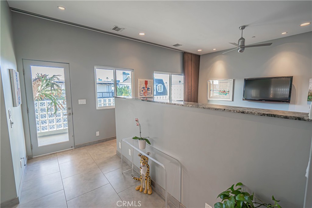 5220 Terramar Way Oxnard, CA 93035 - Photo 57 of 75 a view of an empty room with a window and a kitchen