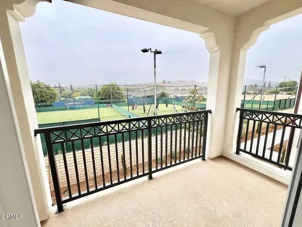 a view of a balcony with city view