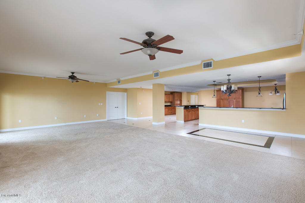 29 Riverside Drive, Unit 502 Cocoa, FL 32922 - Photo 9 of 27 Living to Kitchen