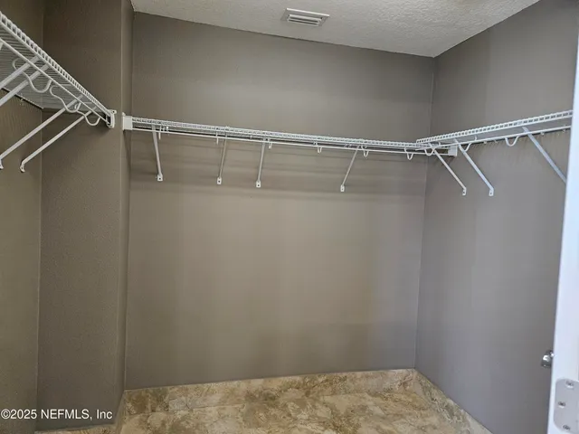 a bathroom with a sink a toilet a mirror a bathtub and shower