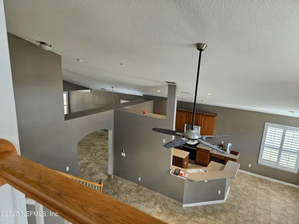 a view of a large room with windows
