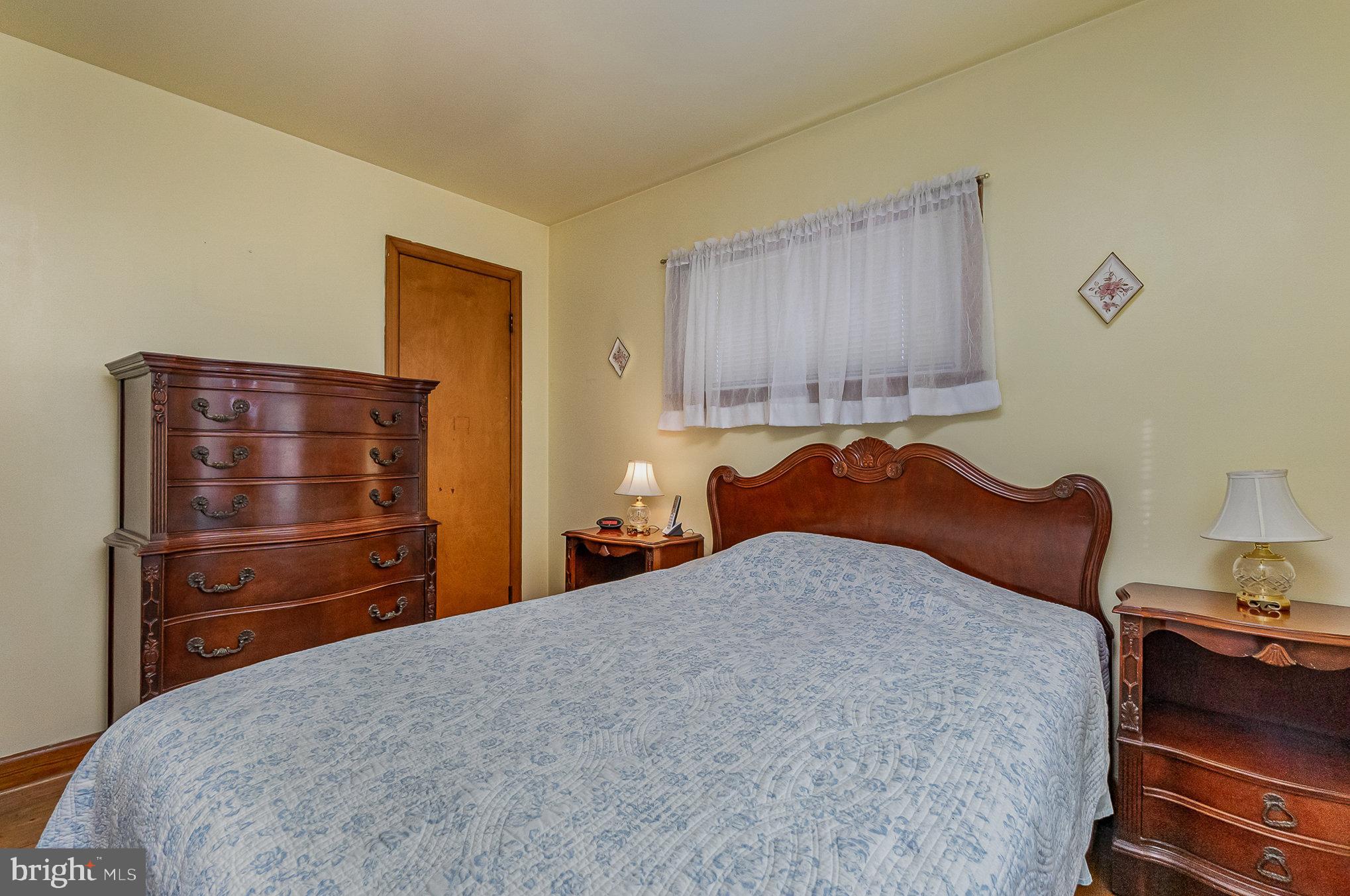 7925 35th Street Rosedale, MD 21237 - Photo 18 of 30 a bedroom with a bed and a dresser