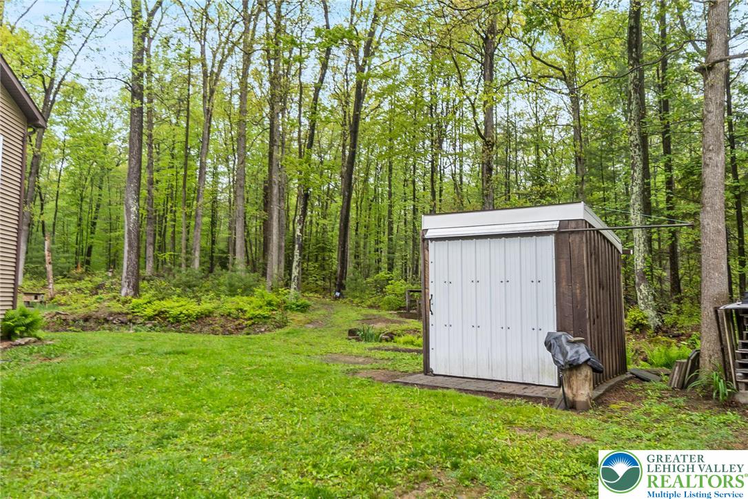 9223 North Loop Road Slatington, PA 18080 - Photo 51 of 60 a view of backyard with potted plants and large trees