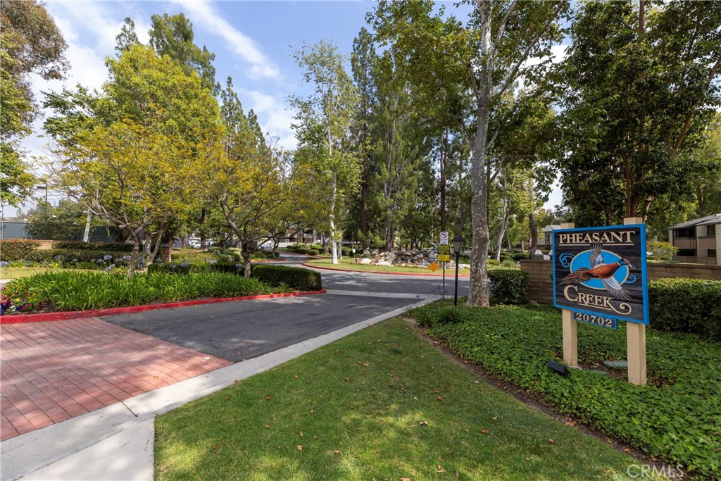 20702 El Toro Road, Unit 178 Lake Forest, CA 92630 - Photo 30 of 30 a sign board with yard in the back