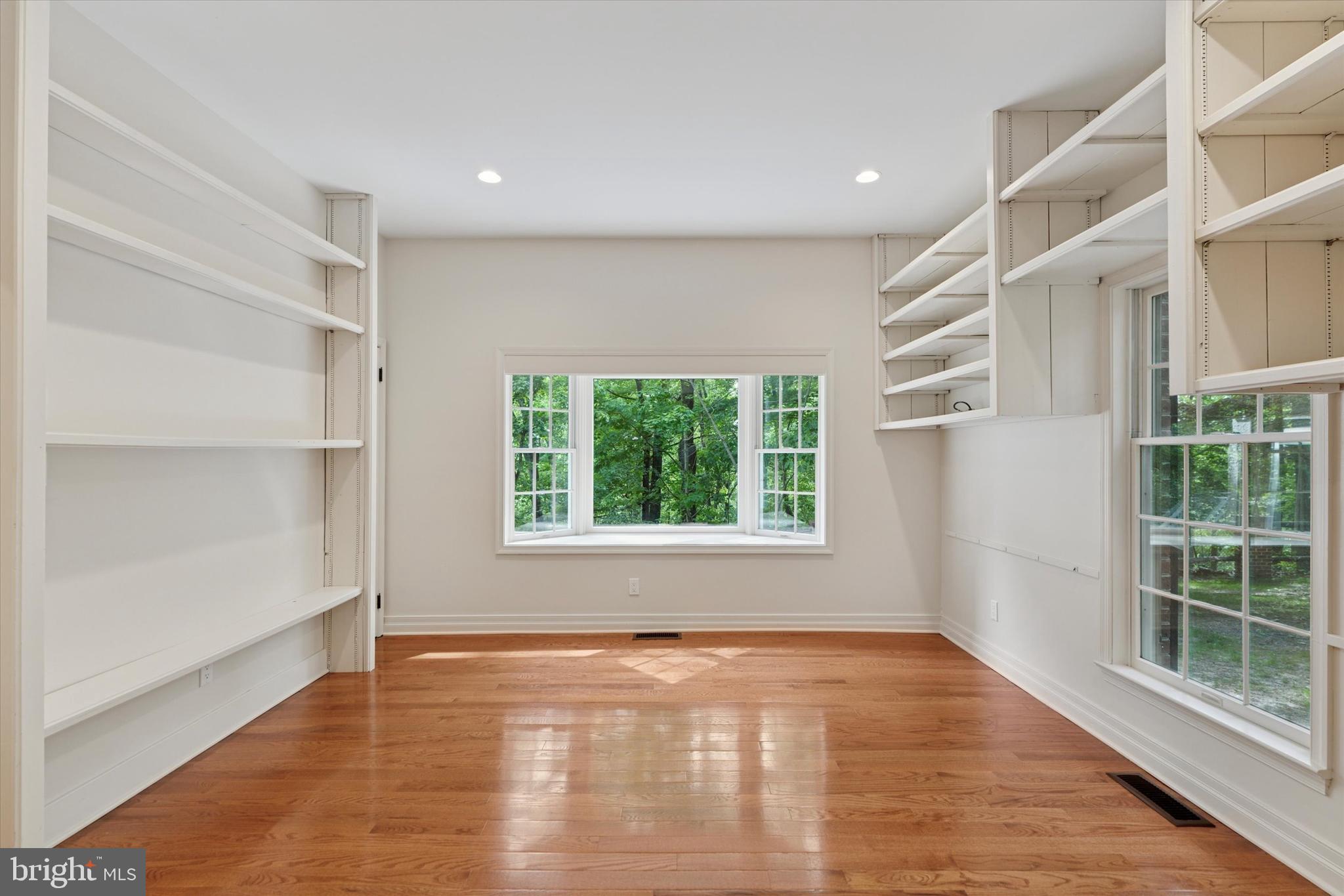 2824 Hill Road Green Lane, PA 18054 - Photo 12 of 40 a view of an empty room with a window and wooden floor