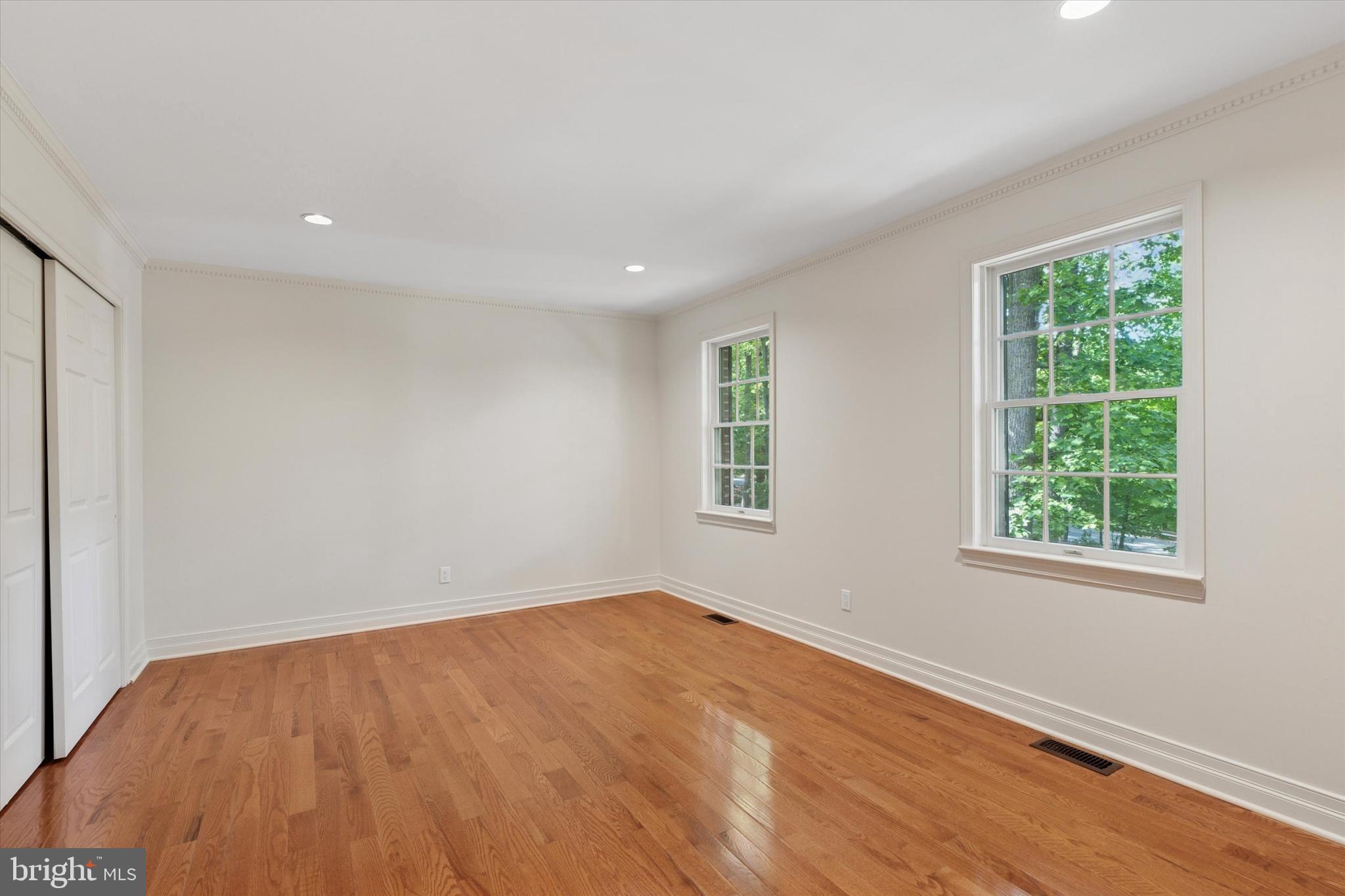 2824 Hill Road Green Lane, PA 18054 - Photo 21 of 40 an empty room with wooden floor and windows
