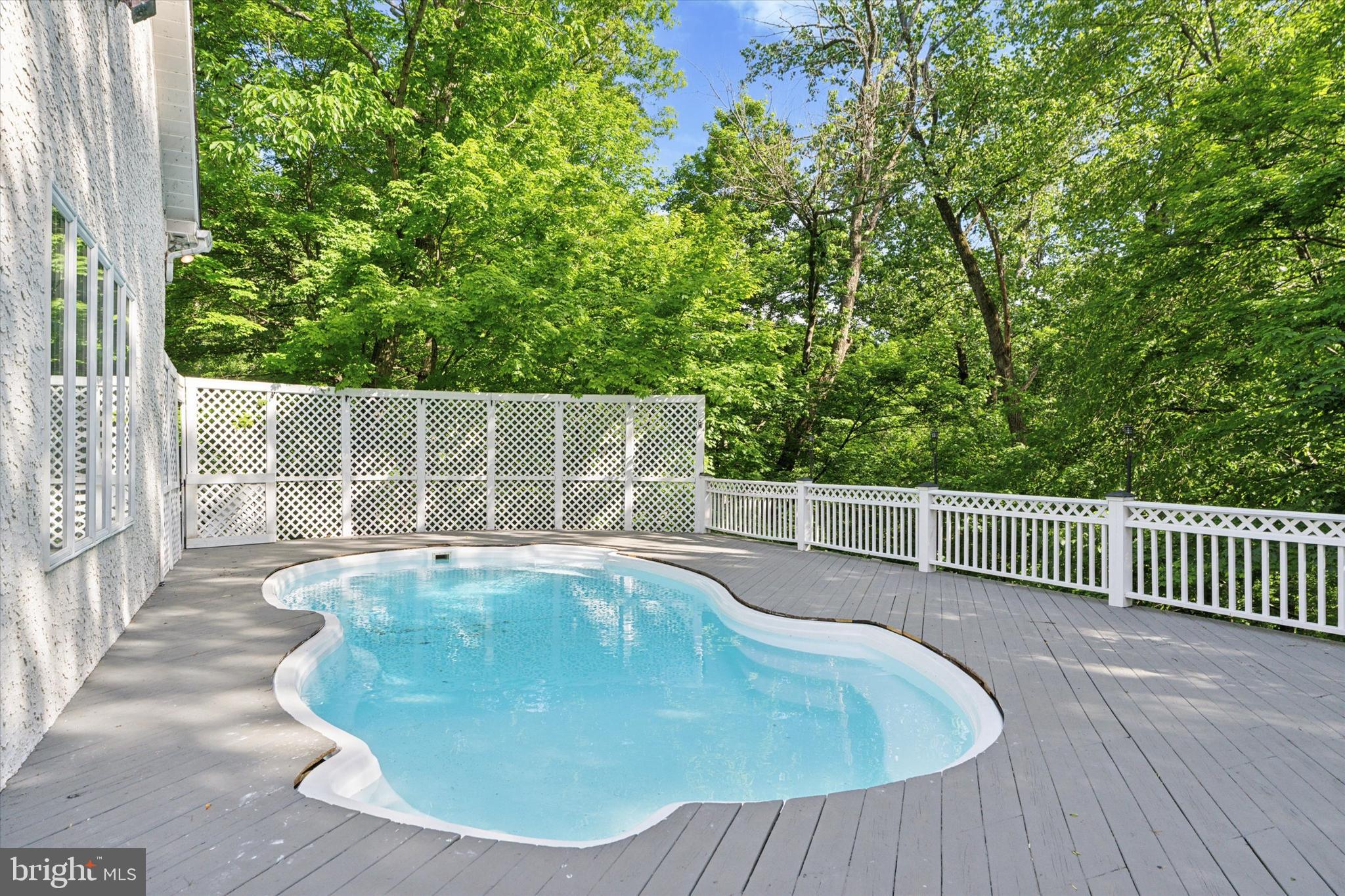 2824 Hill Road Green Lane, PA 18054 - Photo 28 of 40 a view of a swimming pool with a patio and yard