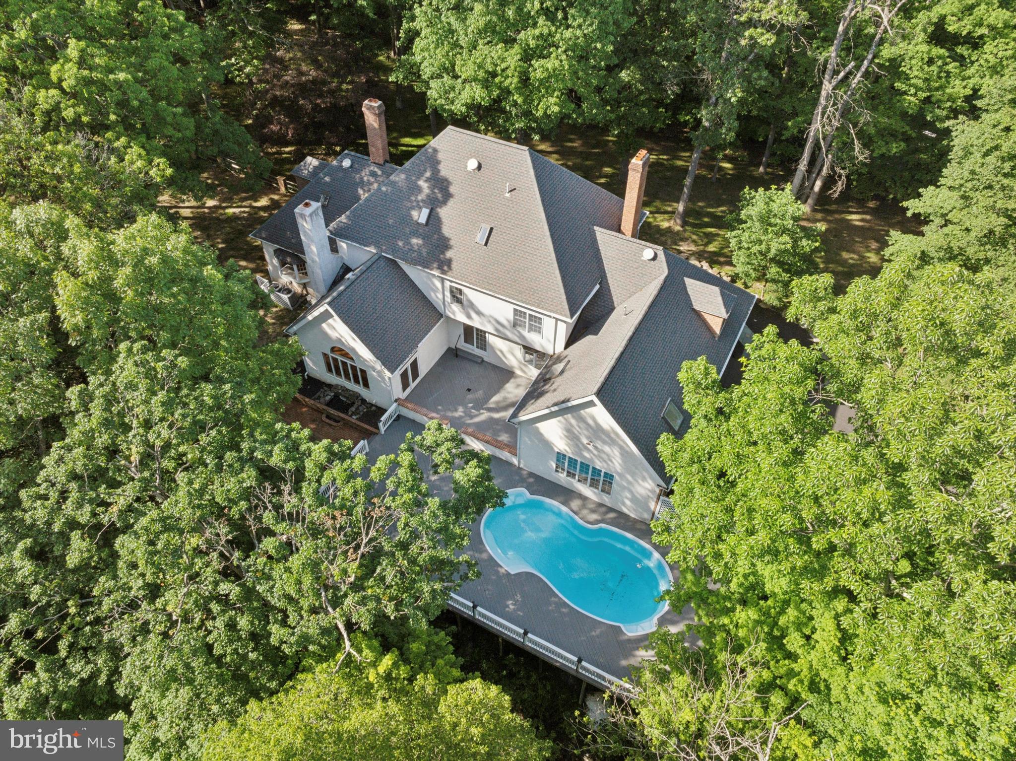 2824 Hill Road Green Lane, PA 18054 - Photo 33 of 40 an aerial view of a house with a yard and trees