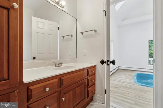 a bathroom with a sink and a mirror