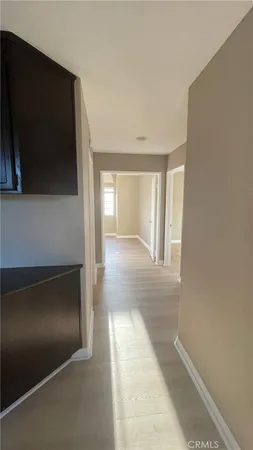 a view of balcony with wooden floor and outdoor seating