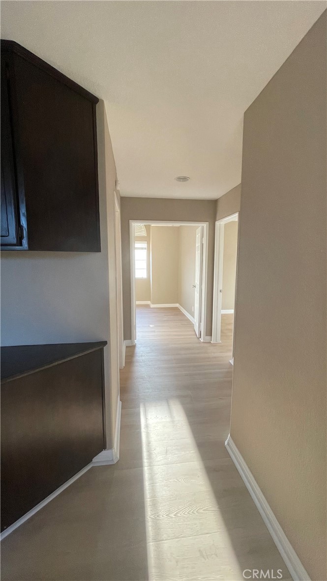 26 Reata Rancho Santa Margarita, CA 92688 - Photo 13 of 15 a view of hallway with wooden floor and a flat screen tv