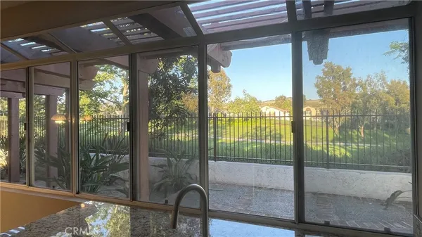 a view of a room with balcony and furniture
