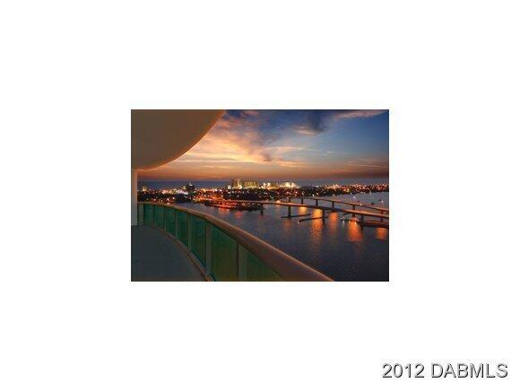 241 Riverside Drive, Unit 905 Holly Hill, FL 32117 - Photo 3 of 8 a picture of a living room with a flat screen tv