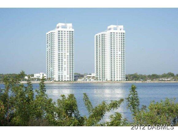 241 Riverside Drive, Unit 905 Holly Hill, FL 32117 - Photo 7 of 8 a view of a kitchen with granite countertop a window