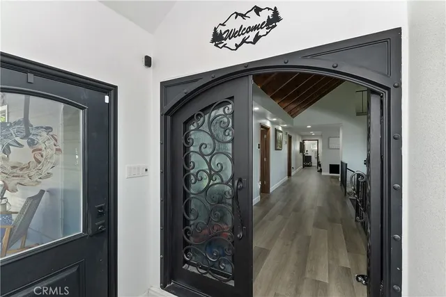 a bathroom with a granite countertop sink double vanity and a mirror