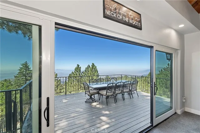 a large white kitchen with stainless steel appliances granite countertop a lot of counter space and a sink