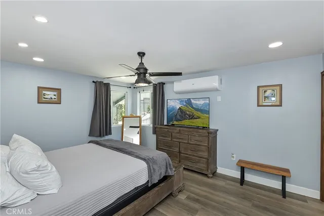 a bed room with two bed and a ceiling fan