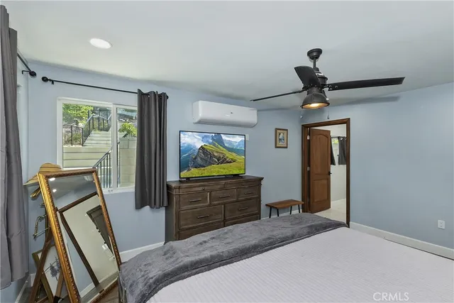 a bathroom with a shower and a sink